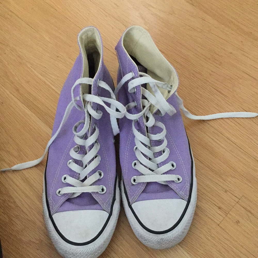 Purple high top converse.